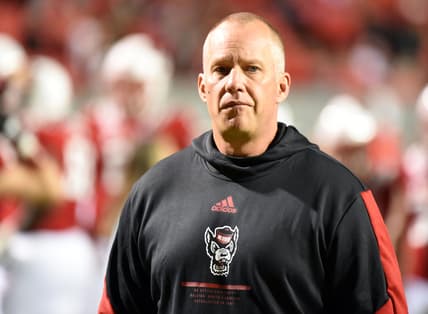 Oct 30, 2021; Raleigh, North Carolina, USA North Carolina State Wolfpack head coach Dave Doeren watches his team warm up prior to a game against the Louisville Cardinals at Carter-Finley Stadium. Mandatory Credit: