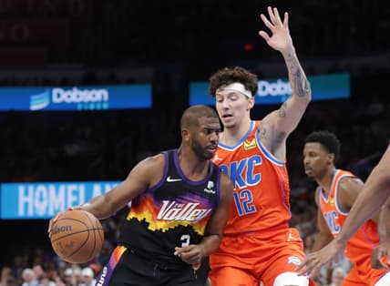 Apr 3, 2022; Oklahoma City, Oklahoma, USA; Phoenix Suns guard Chris Paul (3) is defended by Oklahoma City Thunder forward Lindy Waters III (12) on a play during the second half at Paycom Center. Oklahoma City won 117-96. Mandatory Credit: Alonzo Adams-USA TODAY Sports