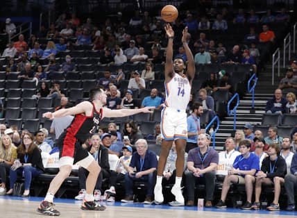 Apr 5, 2022; Oklahoma City, Oklahoma, USA; Oklahoma City Thunder forward Jaylen Hoard (14) shoots a three point basket as Portland Trail Blazers forward Drew Eubanks (24) defends during the second half at Paycom Center. Oklahoma City won 98-94. Mandatory Credit: Alonzo Adams-USA TODAY Sports