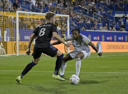Sep 9, 2022; Montreal, Quebec, CAN; CF Montreal midfielder Djordje Mihailovic (8) plays the ball and Columbus Crew defender Steven Moreira (31) defends during the first half at Stade Saputo. Mandatory Credit: Eric Bolte-USA TODAY Sports