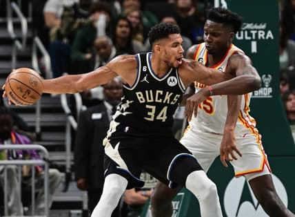 Oct 29, 2022; Milwaukee, Wisconsin, USA; Milwaukee Bucks forward Giannis Antetokounmpo (34) controls the ball against Atlanta Hawks center Clint Capela (15) in the fourth quarter at Fiserv Forum. Mandatory Credit: Benny Sieu-USA TODAY Sports