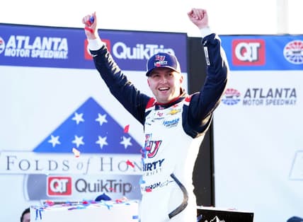 Mar 20, 2022; Hampton, Georgia, USA; NASCAR Cup Series driver William Byron (24) celebrates in victory lane winning the Folds of Honor QuikTrip 500 at Atlanta Motor Speedway. Mandatory Credit: John David Mercer-USA TODAY Sports