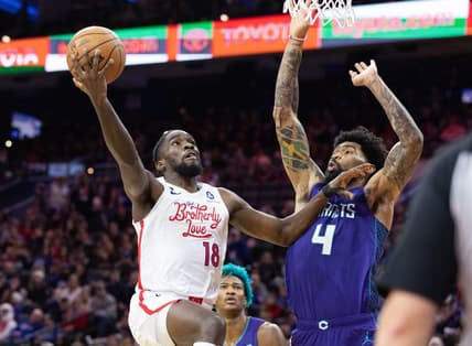 Dec 11, 2022; Philadelphia, Pennsylvania, USA; Philadelphia 76ers guard Shake Milton (18) drives against Charlotte Hornets center Nick Richards (4) during the fourth quarter at Wells Fargo Center. Mandatory Credit: Bill Streicher-USA TODAY Sports