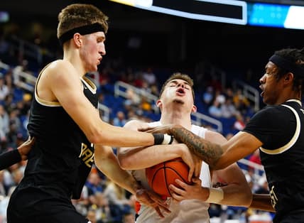Mar 8, 2023; Greensboro, NC, USA; Syracuse Orange guard Joseph Girard III (11) battle for control of the ball against Wake Forest Demon Deacons forward Andrew Carr (11) and guard Lucas Taylor (0) during the first half of the second round of the ACC tournament at Greensboro Coliseum. Mandatory Credit: John David Mercer-USA TODAY Sports