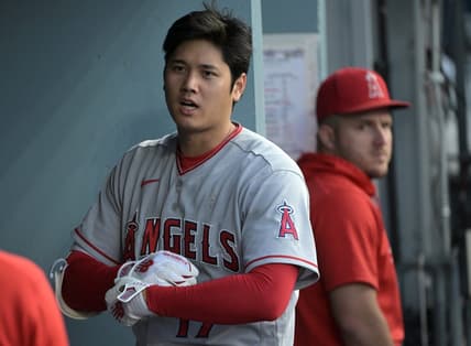 Jul 8, 2023; Los Angeles, California, USA; Los Angeles Angels designated hitter Shohei Ohtani (17) and center fielder Mike Trout (27) look on from the dugout during the game against the Los Angeles Dodgers at Dodger Stadium. Mandatory Credit: Jayne Kamin-Oncea-USA TODAY Sports