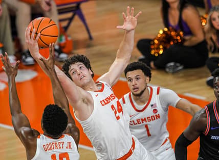 Sunday, November 19, 2023; Clemson junior forward PJ Hall (24) rebounds against Boise State during the first half at Littlejohn Coliseum in Clemson, S.C. Sunday, November 19, 2023.  Mandatory Credit: Ken Ruinard-USA TODAY NETWORK