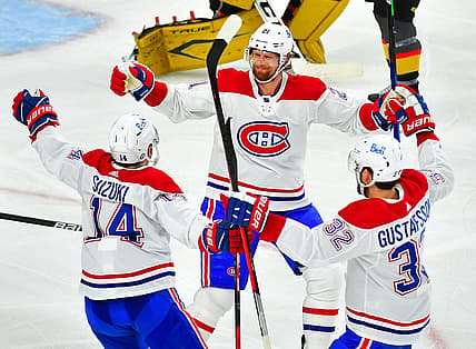Jun 22, 2021; Las Vegas, Nevada, USA; Montreal Canadiens center Eric Staal (21) celebrates with center Nick Suzuki (14) and defenseman Erik Gustafsson (32) after scoring a second period goal against the Vegas Golden Knights in game five of the 2021 Stanley Cup Semifinals at T-Mobile Arena. Mandatory Credit: Stephen R. Sylvanie-USA TODAY Sports