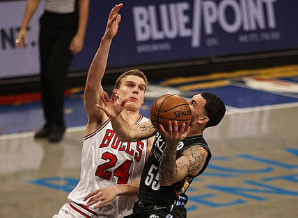 May 15, 2021; Brooklyn, New York, USA; Brooklyn Nets guard Mike James (55) drives the basket while being defended by Chicago Bulls forward Lauri Markkanen (24) during the second half at Barclays Center. Mandatory Credit: Andy Marlin-USA TODAY Sports
