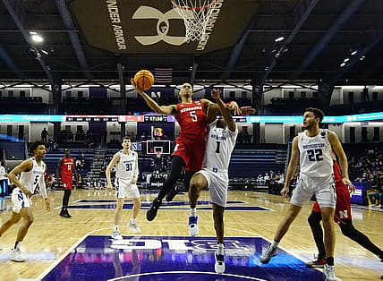 Feb 22, 2022; Evanston, Illinois, USA; Nebraska Cornhuskers guard Bryce McGowens (5) is defended by Northwestern Wildcats guard Chase Audige (1) during the first half at Welsh-Ryan Arena. Mandatory Credit: David Banks-USA TODAY Sports