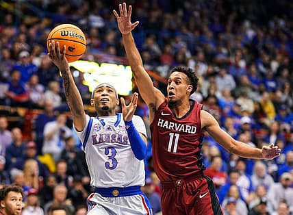Dec 22, 2022; Lawrence, Kansas, USA; Kansas Jayhawks guard Dajuan Harris Jr. (3) shoots against Harvard Crimson guard Evan Nelson (11) during the second half at Allen Fieldhouse. Mandatory Credit: Jay Biggerstaff-USA TODAY Sports
