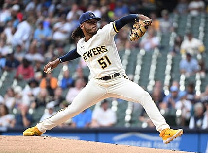 Aug 7, 2023; Milwaukee, Wisconsin, USA; Milwaukee Brewers starting pitcher Freddy Peralta (51) delivers a pitch against the Colorado Rockies in the first inning at American Family Field. Mandatory Credit: Michael McLoone-USA TODAY Sports
