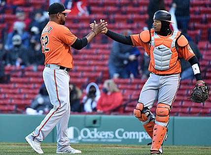 Apr 3, 2021; Boston, Massachusetts, USA; Baltimore Orioles relief pitcher Cesar Valdez (62) is congratulated by catcher Pedro Severino (28) after defeating the Boston Red Sox at Fenway Park. Mandatory Credit: Bob DeChiara-USA TODAY Sports