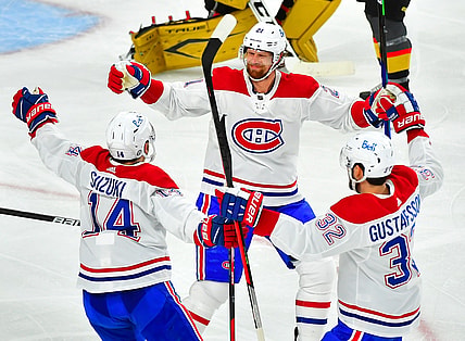 Jun 22, 2021; Las Vegas, Nevada, USA; Montreal Canadiens center Eric Staal (21) celebrates with center Nick Suzuki (14) and defenseman Erik Gustafsson (32) after scoring a second period goal against the Vegas Golden Knights in game five of the 2021 Stanley Cup Semifinals at T-Mobile Arena. Mandatory Credit: Stephen R. Sylvanie-USA TODAY Sports