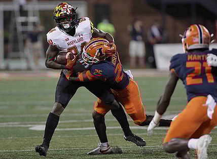 Sep 17, 2021; Champaign, Illinois, USA;  Illinois Fighting Illini defensive back Kerby Joseph (25) tackles Maryland Terrapins tight end Corey Dyches (84) in the first half at Memorial Stadium. Mandatory Credit: Ron Johnson-USA TODAY Sports