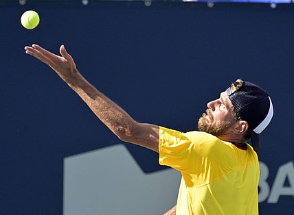 Aug 10, 2022; Montreal, QC, Canada; Maxime Cressy (USA) serves against Gael Monfils (FRA) (not pictured) in second round play at IGA Stadium. Mandatory Credit: Eric Bolte-USA TODAY Sports