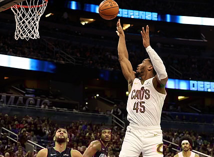 Jan 22, 2024; Orlando, Florida, USA; Cleveland Cavaliers guard Donovan Mitchell (45) makes a jump shot against the Orlando Magic during the second quarter at Kia Center. Mandatory Credit: Kim Klement Neitzel-USA TODAY Sports