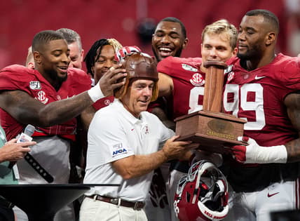 Alabama's Nick Saban holds trophy after defeating Duke