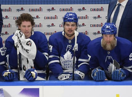 May 8, 2021; Toronto, Ontario, CAN; Toronto Maple Leafs top line of Mitch Marner (left) and Auston Matthews (34) and Joe Thornton (97) take a break during a stoppage in play in the third period against the Montreal Canadiens at Scotiabank Arena. Mandatory Credit: Dan Hamilton-USA TODAY Sports