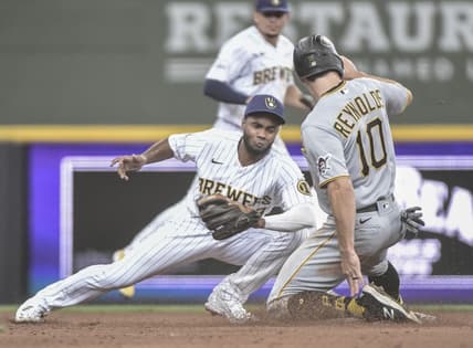Jun 12, 2021; Milwaukee, Wisconsin, USA; Pittsburgh Pirates center fielder Bryan Reynolds (10) steals second base ahead of the tag by Milwaukee Brewers third baseman Pablo Reyes (left) during the third inning at American Family Field. Mandatory Credit: Benny Sieu-USA TODAY Sports