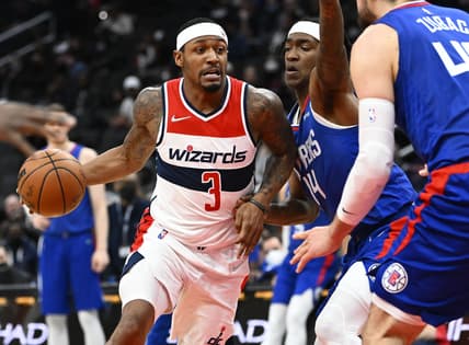 Jan 25, 2022; Washington, District of Columbia, USA; Washington Wizards guard Bradley Beal (3) dribbles as LA Clippers guard Terance Mann (14) defends during the first half at Capital One Arena. Mandatory Credit: Brad Mills-USA TODAY Sports