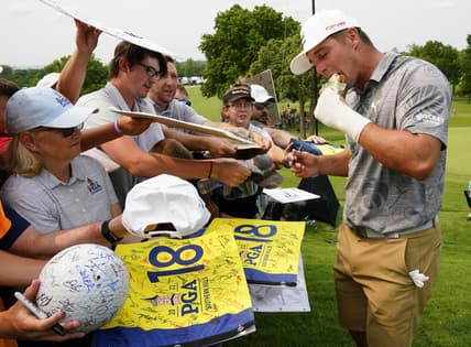 May 17, 2022; Tulsa, Oklahoma, USA; Bryson DeChambeau eats a peanut butter and grape jelly sandwich after his practice round for the PGA Championship golf tournament at Southern Hills Country Club. Mandatory Credit: Michael Madrid-USA TODAY Sports