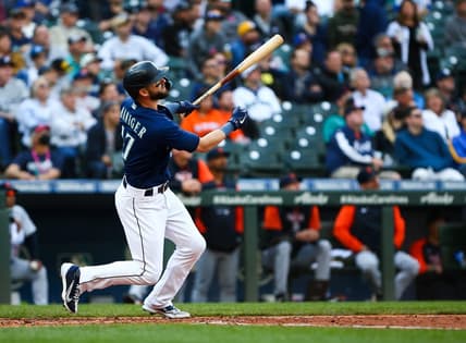 Oct 4, 2022; Seattle, Washington, USA;  Seattle Mariners right fielder Mitch Haniger (17) follows through on a two-run home run against the Detroit Tigers during the third inning at T-Mobile Park. Mandatory Credit: Lindsey Wasson-USA TODAY Sports