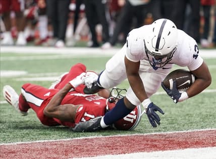 Nov 5, 2022; Bloomington, Indiana, USA; Penn State Nittany Lions running back Kaytron Allen (13) runs for a touchdown past Indiana Hoosiers defensive back Jonathan Haynes (17) during the first half at Memorial Stadium. Mandatory Credit: Robert Goddin-USA TODAY Sports