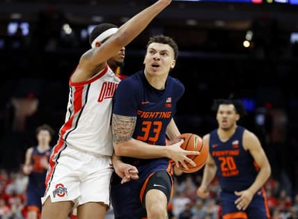 Feb 26, 2023; Columbus, Ohio, USA; Illinois Fighting Illini forward Coleman Hawkins (33) drives in for the score as Ohio State Buckeyes guard Roddy Gayle Jr. (1) defends during the first half at Value City Arena. Mandatory Credit: Joseph Maiorana-USA TODAY Sports
