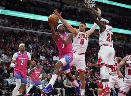 Feb 26, 2023; Chicago, Illinois, USA; Chicago Bulls guard Patrick Beverly (21) and center Nikola Vucevic (9) defend Washington Wizards guard Bradley Beal (3) during the first half at United Center. Mandatory Credit: David Banks-USA TODAY Sports