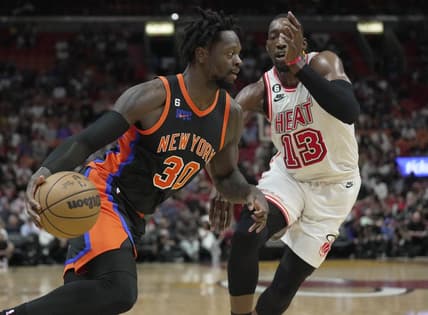 Mar 3, 2023; Miami, Florida, USA;  New York Knicks forward Julius Randle (30) drives past Miami Heat center Bam Adebayo (13) during the first half at Miami-Dade Arena. Mandatory Credit: Jim Rassol-USA TODAY Sports