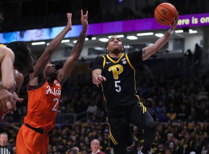 Pittsburgh Panthers Ishmael Leggett (5) goes for a layup after getting around Virginia Tech Hokies MJ Collins (2) during the first half on February 24, 2024 at the Petersen Events Center in Pittsburgh, PA.