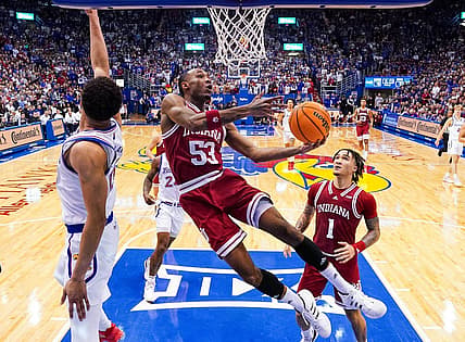 Dec 17, 2022; Lawrence, Kansas, USA; Indiana Hoosiers guard Tamar Bates (53) shoots against Kansas Jayhawks guard Kevin McCullar Jr. (15) during the second half at Allen Fieldhouse. Mandatory Credit: Jay Biggerstaff-USA TODAY Sports