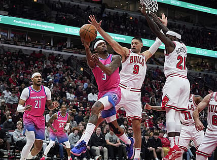 Feb 26, 2023; Chicago, Illinois, USA; Chicago Bulls guard Patrick Beverly (21) and center Nikola Vucevic (9) defend Washington Wizards guard Bradley Beal (3) during the first half at United Center. Mandatory Credit: David Banks-USA TODAY Sports