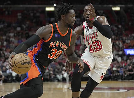 Mar 3, 2023; Miami, Florida, USA;  New York Knicks forward Julius Randle (30) drives past Miami Heat center Bam Adebayo (13) during the first half at Miami-Dade Arena. Mandatory Credit: Jim Rassol-USA TODAY Sports