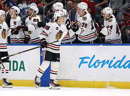 Nov 9, 2023; Tampa, Florida, USA; Chicago Blackhawks center Connor Bedard (98) is congratulated after he scored a goal against the Tampa Bay Lightning during the first period at Amalie Arena. Mandatory Credit: Kim Klement Neitzel-USA TODAY Sports