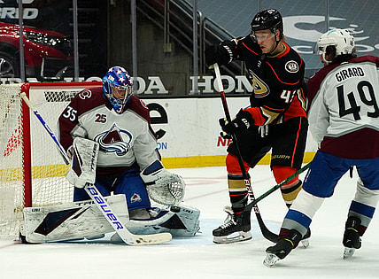 Apr 9, 2021; Anaheim, California, USA; Colorado Avalanche goaltender Jonas Johansson (35) blocks a shot as defenseman Samuel Girard (49) moves in to help defend against Anaheim Ducks center Danton Heinen (43) during the second period at Honda Center. Mandatory Credit: Gary A. Vasquez-USA TODAY Sports