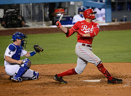 Apr 27, 2021; Los Angeles, California, USA; Cincinnati Reds first baseman Joey Votto (19) hits a two run RBI double against the Los Angeles Dodgers during the seventh inning at Dodger Stadium. Mandatory Credit: Gary A. Vasquez-USA TODAY Sports