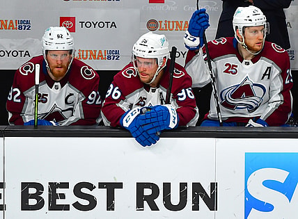 Jun 6, 2021; Las Vegas, Nevada, USA; Colorado Avalanche left wing Gabriel Landeskog (92), Colorado Avalanche right wing Mikko Rantanen (96), and Colorado Avalanche center Nathan MacKinnon (29) are pictured on the bench late in the third period of game four of the second round of the 2021 Stanley Cup Playoffs against the Vegas Golden Knights at T-Mobile Arena. Mandatory Credit: Stephen R. Sylvanie-USA TODAY Sports