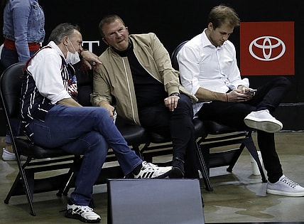 May 14, 2021; Houston, Texas, USA; Houston Rockets owner Tilman Fertitta (center) and team president Tad Brown (left) and Patrick Fertitta (right) sit court-side as the Houston Rockets play the LA Clippers at Toyota Center. Mandatory Credit:  Bob Levey/Pool Photo-USA TODAY Sports