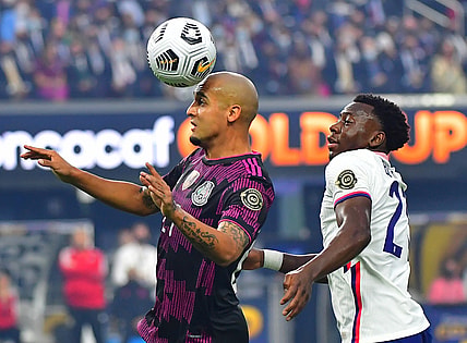 Aug 1, 2021; Las Vegas, Nevada, USA; Mexico defender Luis Rodriguez (21) heads the ball in front of USA defender George Bello (21) during the first half of the CONCACAF Gold Cup final soccer match at Allegiant Stadium. Mandatory Credit: Stephen R. Sylvanie-USA TODAY Sports