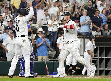Aug 27, 2021; Chicago, Illinois, USA; Chicago White Sox catcher Yasmani Grandal (24) celebrates with third baseman Yoan Moncada (10) after hitting a three-run home run against the Chicago Cubs during the third inning at Guaranteed Rate Field. Mandatory Credit: Mike Dinovo-USA TODAY Sports