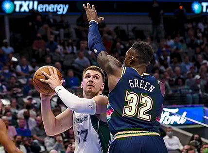 Nov 15, 2021; Dallas, Texas, USA;  Dallas Mavericks guard Luka Doncic (77) looks to shoot as Denver Nuggets forward Jeff Green (32) defends during the first quarter at American Airlines Center. Mandatory Credit: Kevin Jairaj-USA TODAY Sports