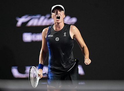 Nov 5, 2023; Cancun, Mexico; Iga Swiatek (POL) celebrates winning her match against Aryna Sabalenka (BLR) on day eight of the GNP Saguaros WTA Finals Cancun. Mandatory Credit: Susan Mullane-USA TODAY Sports