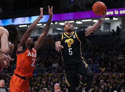 Pittsburgh Panthers Ishmael Leggett (5) goes for a layup after getting around Virginia Tech Hokies MJ Collins (2) during the first half on February 24, 2024 at the Petersen Events Center in Pittsburgh, PA.