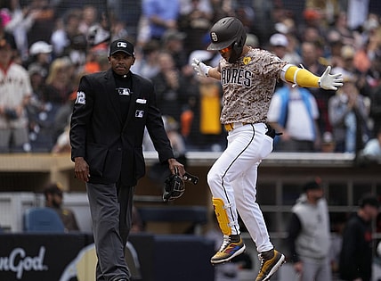 Mar 31, 2024; San Diego, California, USA; San Diego Padres shortstop Ha-Seong Kim (7) reacts after hitting a home run against the San Francisco Giants during the second inning at Petco Park. Mandatory Credit: Ray Acevedo-USA TODAY Sports