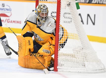 Apr 3, 2021; Nashville, Tennessee, USA; Nashville Predators goaltender Juuse Saros (74) watches the puck in the corner during the second period against the Chicago Blackhawks at Bridgestone Arena. Mandatory Credit: Christopher Hanewinckel-USA TODAY Sports