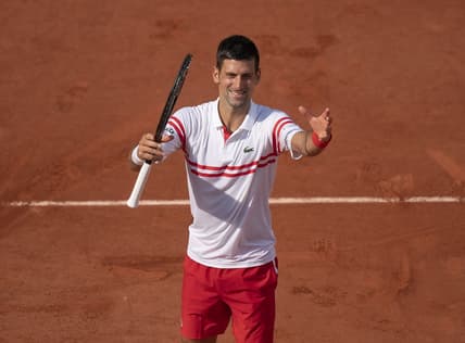 Jun 3, 2021; Paris, France;  Novak Djokovic (SRB) celebrates winning his match against Pablo Cuevas (URU) on day five of the French Open at Stade Roland Garros. Mandatory Credit: Susan Mullane-USA TODAY Sports