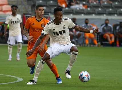 May 1, 2021; Houston, Texas, USA; Los Angeles FC midfielder Mark-Anthony Kaye (14) in action during the match against the Houston Dynamo FC at BBVA Stadium. Mandatory Credit: Troy Taormina-USA TODAY Sports