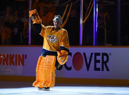 May 21, 2021; Nashville, Tennessee, USA; Nashville Predators goaltender Juuse Saros (74) waives to the crowd after being named the third star of the game after a double overtime win against the Carolina Hurricanes in game three of the first round of the 2021 Stanley Cup Playoffs at Bridgestone Arena. Mandatory Credit: Christopher Hanewinckel-USA TODAY Sports