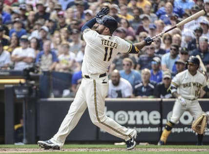 Aug 4, 2021; Milwaukee, Wisconsin, USA; Milwaukee Brewers first baseman Rowdy Tellez (11) hits a three-run home run in the seventh inning against the Pittsburgh Pirates at American Family Field. Mandatory Credit: Benny Sieu-USA TODAY Sports